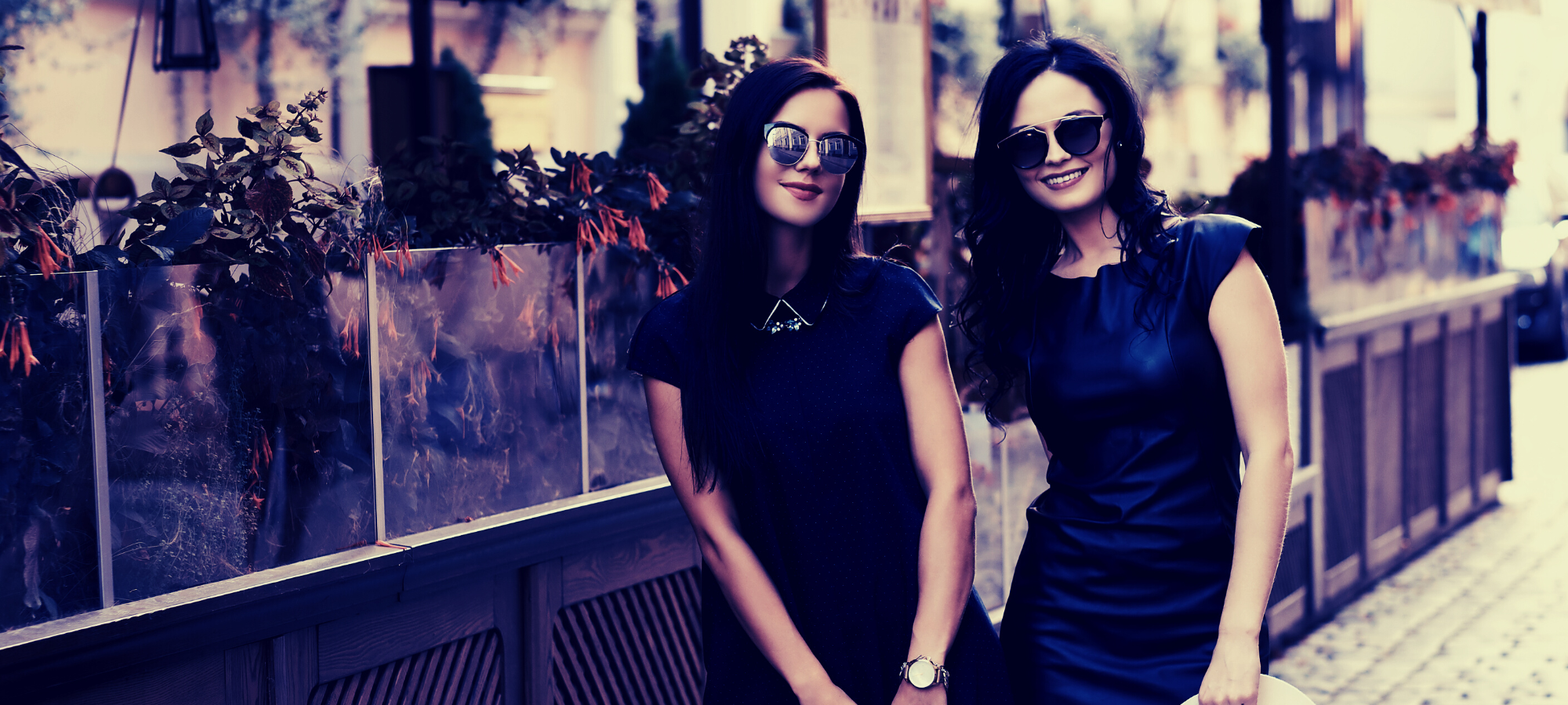 two ladies in tailored dresses